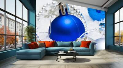 blue festive decoration on snow Wall mural