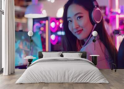 Smiling Young Gamer Woman Enjoying Video Games at Night Wall mural