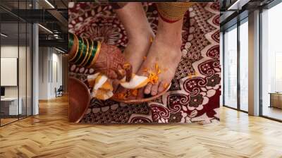 Yellow Petals On Leg of Groom in Hindu Wedding Rituals. Yellow Petals as Swastik. Swastik in Hinduism Symbol Of God Wall mural