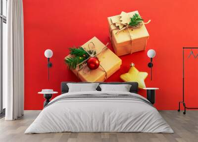 Two gifts in boxes and Christmas toy star on red background, top view. New Year concept Wall mural