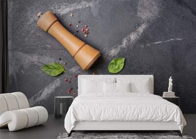 Bright spices, basil leaves with pepper mill for tasty cooking Wall mural