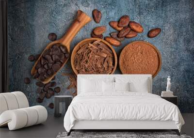 Top view of chocolate chips and drops or morsels with cocoa beans and powder for confectionery Wall mural