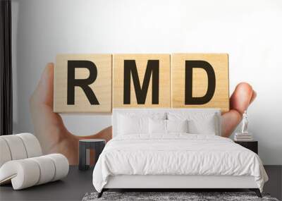 Hand holds wooden cubes with letters rmd. Business concept image. Wall mural