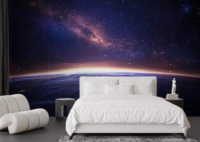 A space scene with Earth glowing among a sea of stars, floating in the universe Wall mural