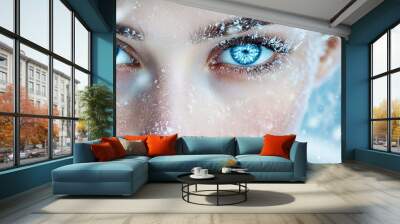 Close-up of a woman's serene expression, snowflakes resting on her skin, with her captivating frozen blue eyes creating a magical and frosty winter fantasy atmosphere Wall mural