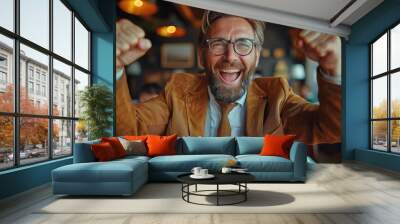 Bearded man in glasses rejoices his victory Wall mural