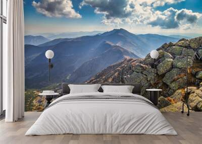 Mountainous landscape with hills and valleys at a sunny day in autumn season.  Dumbier, the highest peak of the Low Tatras National Park in background, Slovakia, Europe Wall mural