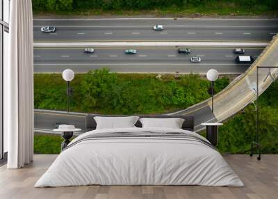 Cars on the highway taking jug handle off-ramp Wall mural