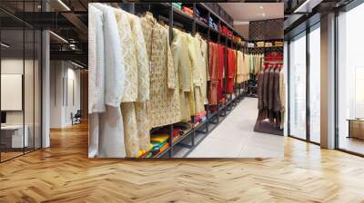 Pune ,INDIA, 2 October 2021 : Indian men latest fashion dress hung on hangers, in display in retail shop in market, wedding wear for men India Wall mural