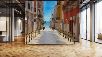 Aerial view of narrow street surrounded by buildings in Manfredonia Wall mural