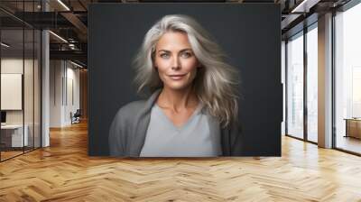 A woman with blonde hair and a grey sweater smiling at the camera Generative AI Wall mural