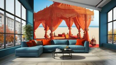 In the absence of people, set against a beach backdrop, the Indian wedding setup features a warm color scheme with an orange theme, adorned with traditional style decorations. AI generated image. Wall mural