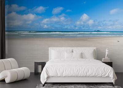 View of Enseada Beach, a beautiful beach with view to the sand, the sea on a blue sky day and few clouds. Guaruja - SP, Brazil. Wall mural