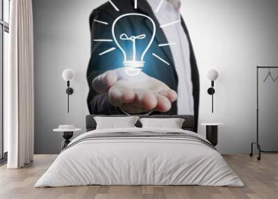  business person holding light bulb Wall mural