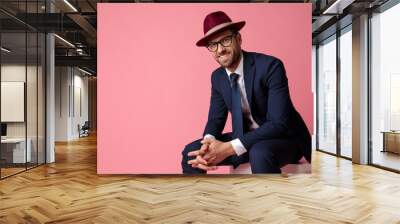 businessman sitting and holding hands while looking at camera happy Wall mural