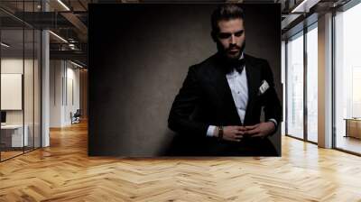 businessman sitting and opening jacket with style Wall mural