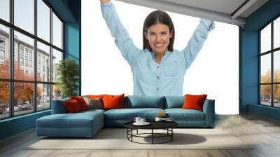 casual woman celebrating succes with her arms up Wall mural