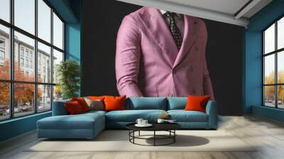 confident fashion guy with sunglasses wearing double breasted pink suit Wall mural