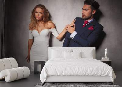 elegant fashion man is pushed away by his lover Wall mural