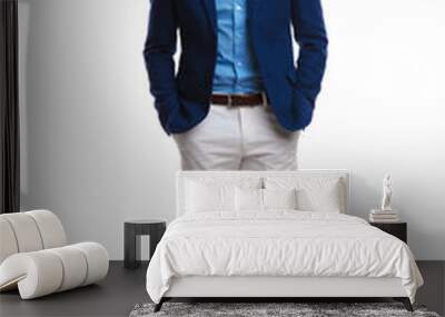 happy young smart casual man standing with hands in pockets Wall mural