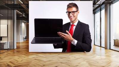 man presenting you with a new laptop Wall mural