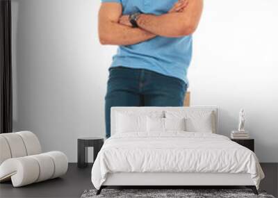 man wearing glasses posing leaning on wooden box Wall mural