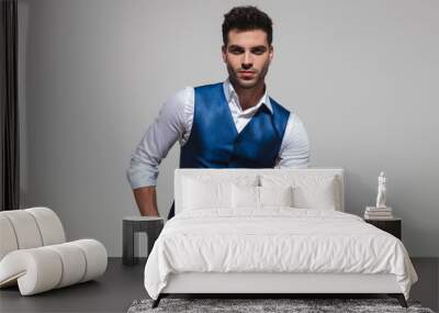 relaxed stylish man wearing a blue vest Wall mural