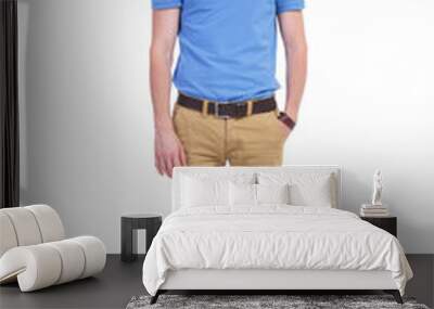 serious casual young man with hand in pocket Wall mural