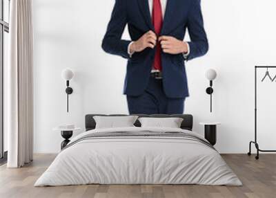 sexy stylish businessman buttoning suit and walking Wall mural