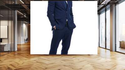 smiling young man in navy blue suit holding hands in pockets Wall mural