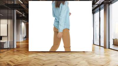 young casual woman walking one way and looking the other Wall mural