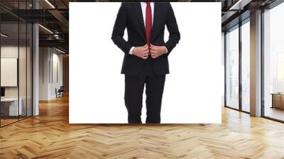 young smiling businessman buttoning his suit while standing Wall mural