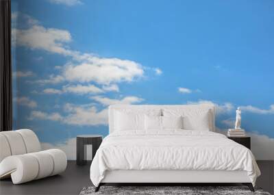 Beautiful scene group of white fluffy clouds floating over the clear blue sky in the afternoon tranquil day. Cloudscape background with outdoor sunlight. Concept of freedom, relaxation. Wall mural