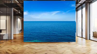 Blue sea waters and clear blue sky horizon Wall mural