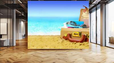 Full open suitcase on tropical beach background, banner Wall mural