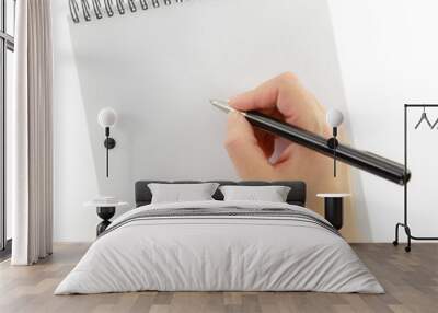 Hand writing gesture with pen and notebook isolated Wall mural