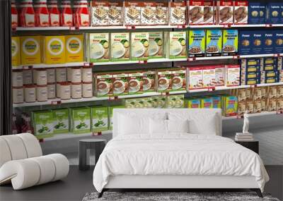 Supermarket shelves full of various products. Wall mural