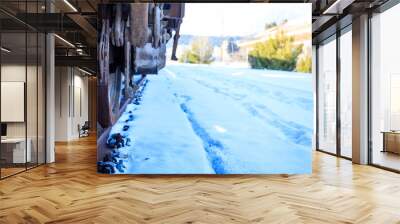 Train closeup on snowy railroad tracks Wall mural