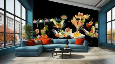 Various elegant gourmet dishes on black background Wall mural