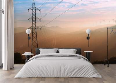 Wind turbines during sunset with Andalusian hills, Atlantic ocean and mountain of Africa on background. Wall mural