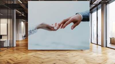 wedding photo session: the bride and groom hold hands and exchange wedding rings Wall mural