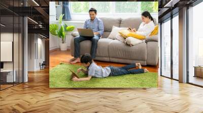 Internet addict concept, Asian parent Each one using private device while together in the living room Wall mural