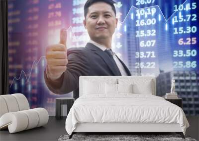 Investor showing thumbs up for great trade stock market with digital stock market electronic board. Wall mural