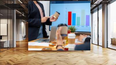 The young woman is presenting a product sample in the meeting Wall mural