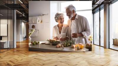 Caucasian senior couple cooking and having dinner together in kitchen house background. Old people cooking and making salad nutrition cuisine menu. Wall mural