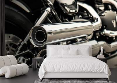 Close-up of a motorcycle's chrome exhaust pipes and rear tire. Wall mural