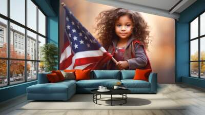 Cute little blond hair girl holding American flag in her hand laughing on sunny day in celebration parade inside city background. Independence Day and nation flag day concept Wall mural