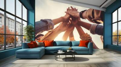 Group of people hand raise together with sky background in the city. Uprisen angle outdoor. Wall mural