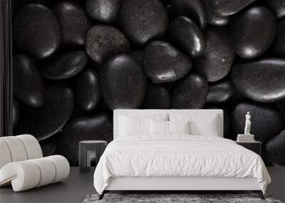 Black river stones texture and background. Wall mural