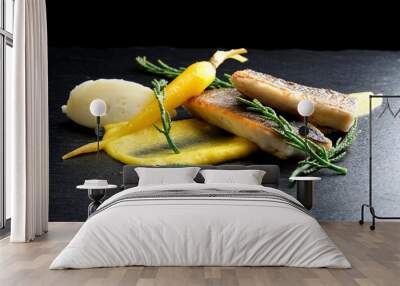 fine dining seabass fillets on carrot potato purree and spices Wall mural